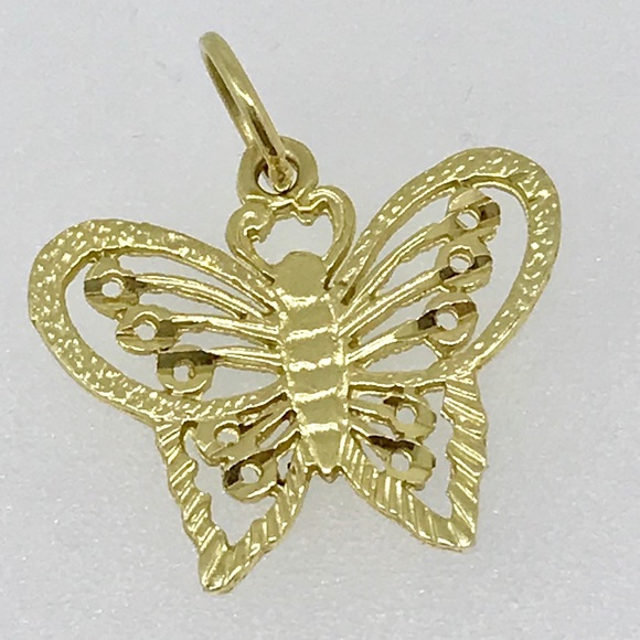 Jewelry - 14 kt butterfly charm and 14 kt bale